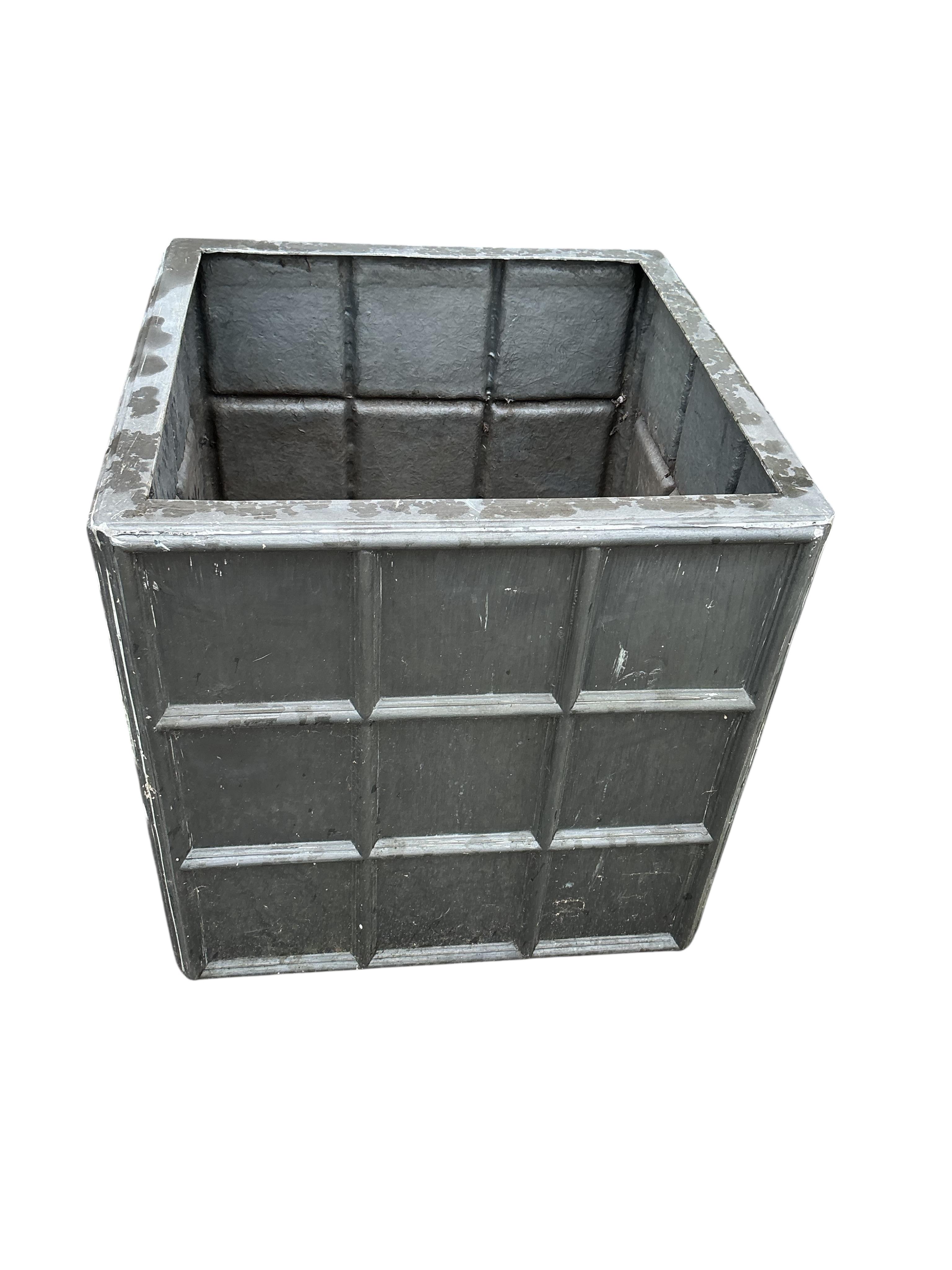 A pair of modern fibreglass faux lead garden planters, width 69cm, height 60cm